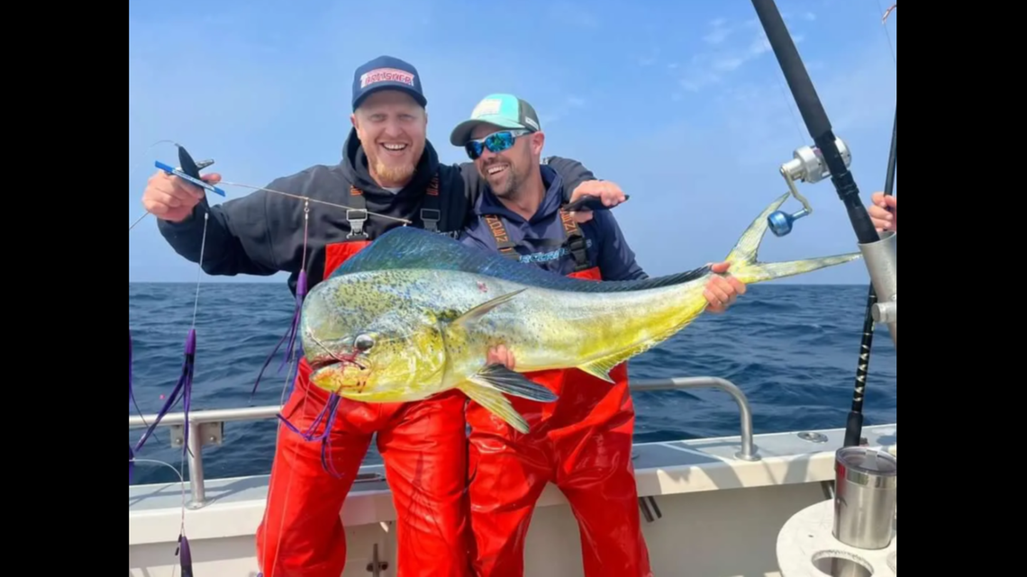Wade La Fontaine and Captain Keith Johnson after landing the state record mahi mahi on a trolling rig.