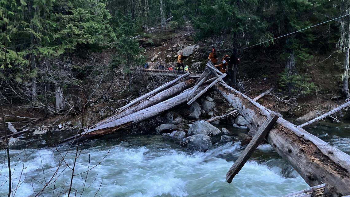 Two men were injured trying to cross a rushing creek while on the Icicle Creek Trail, Washington deputies said.