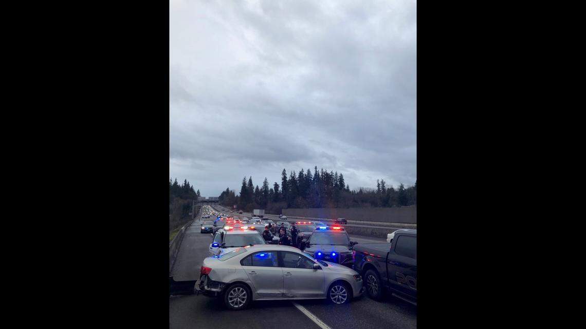 A woman was arrested after stealing a car with children inside, Oregon police say.