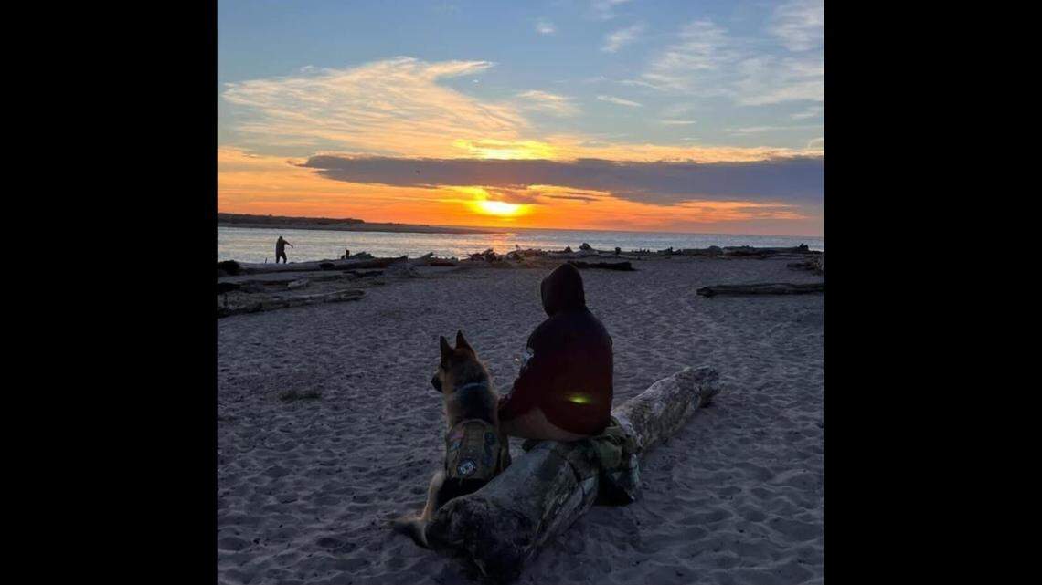 Julian Desmarais is seen on a beach in Lincoln City, Oregon, with his dog Koda. The animal died in November.