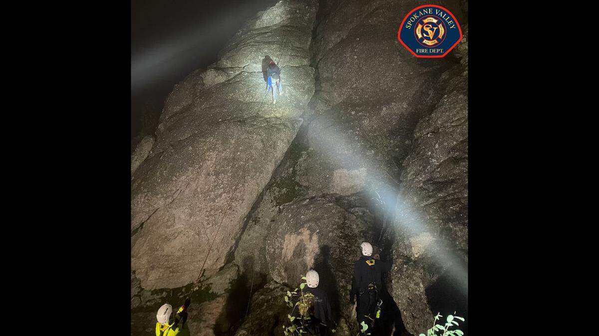 Rescuers lowered four teens from steep rock formations.