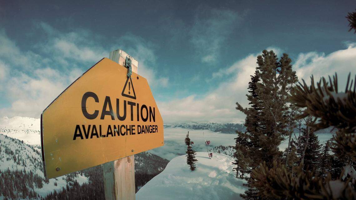 Two snowmobilers were caught in the slab avalanche, which buried and killed one of them.