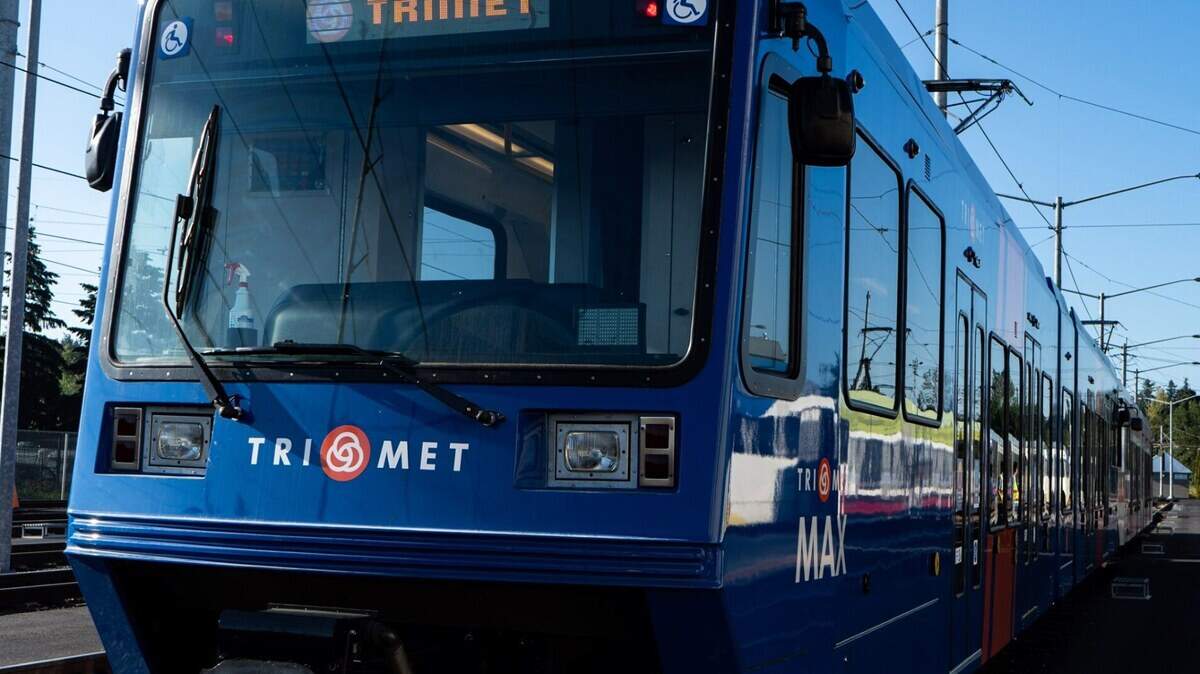 A TriMet MAX Light Rail avoided hitting a rider who was shoved onto the tracks May 21 in Portland, deputies said. Photo does not show the exact train.