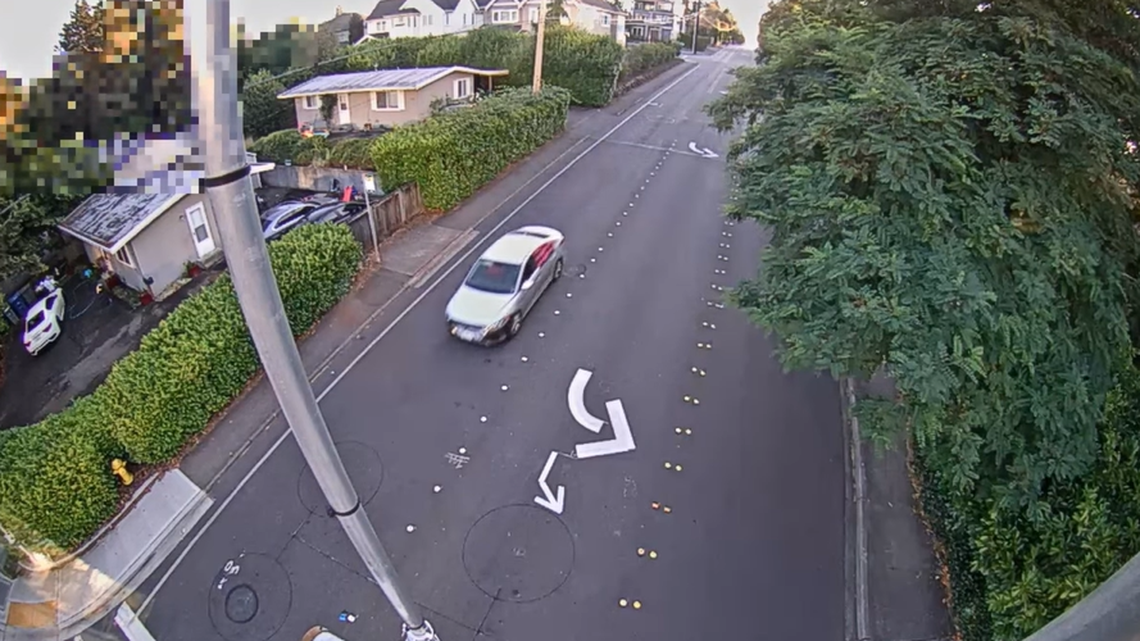 A traffic camera recorded a silver Hyundai Elantra driving through an intersection shortly after the driver struck a cyclist, police said.