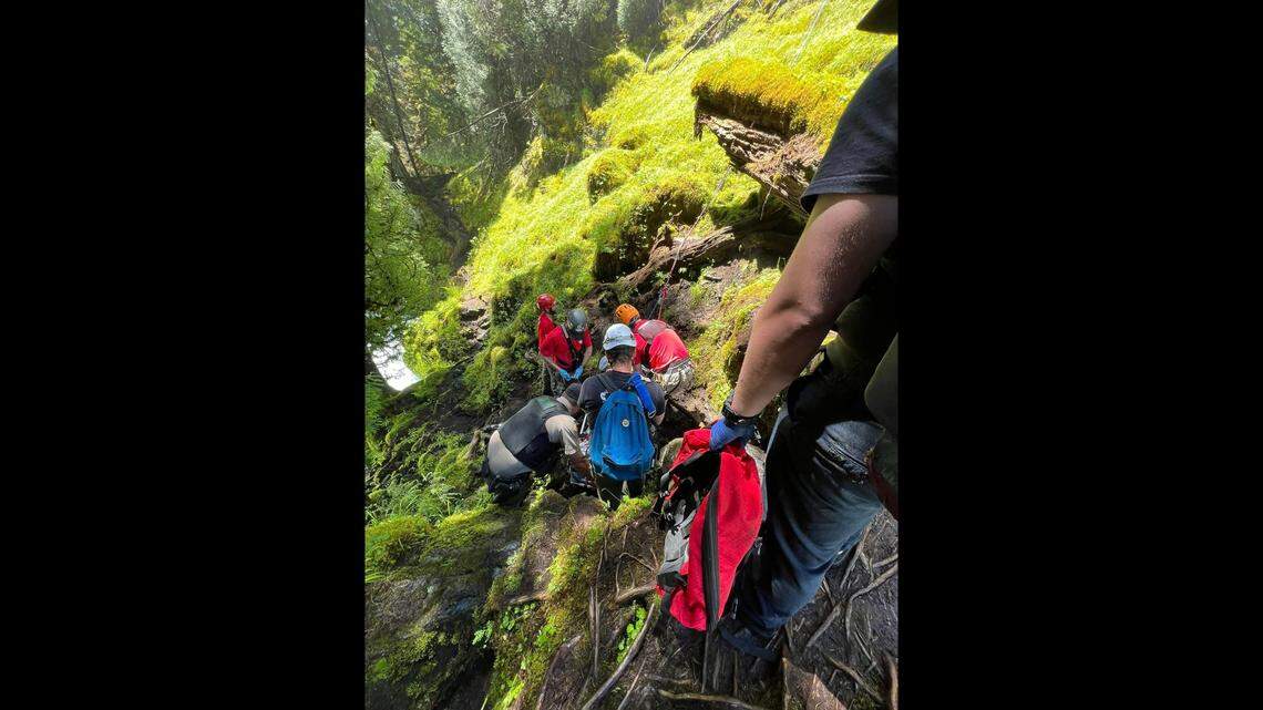 Rescuers used a rope system to hoist the man back up the falls.
