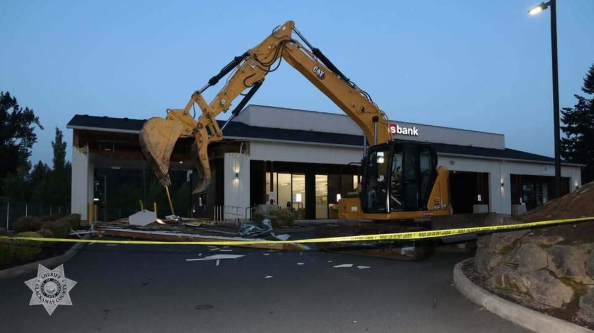 A U.S. Bank in Clackamas, Oregon, was damaged by a stolen excavator, deputies said.