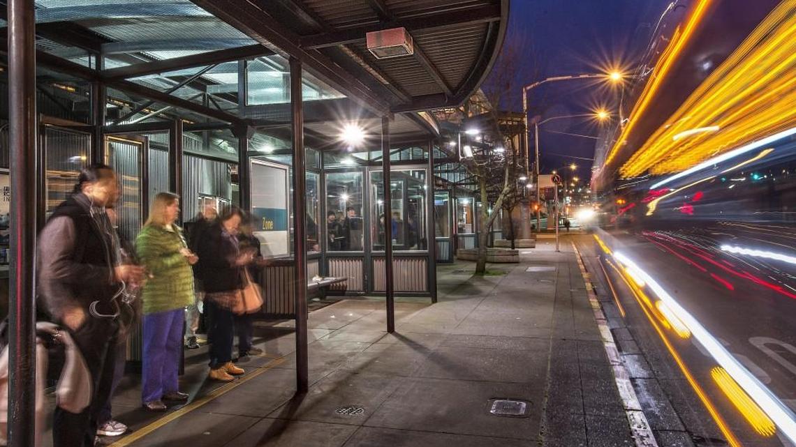 Commuters wait for a Sound Transit Express bus heading for Seattle in 2016 at the Tacoma Dome Station. Lawmakers and taxpayers have been outraged by the increased cost of car-tab fees under Sound Transit 3, the $54 billion transit package voters approved in November. But lawmakers were the ones who authorized Sound Transit to collect those taxes — and provided the specific means for doing so — in 2015.