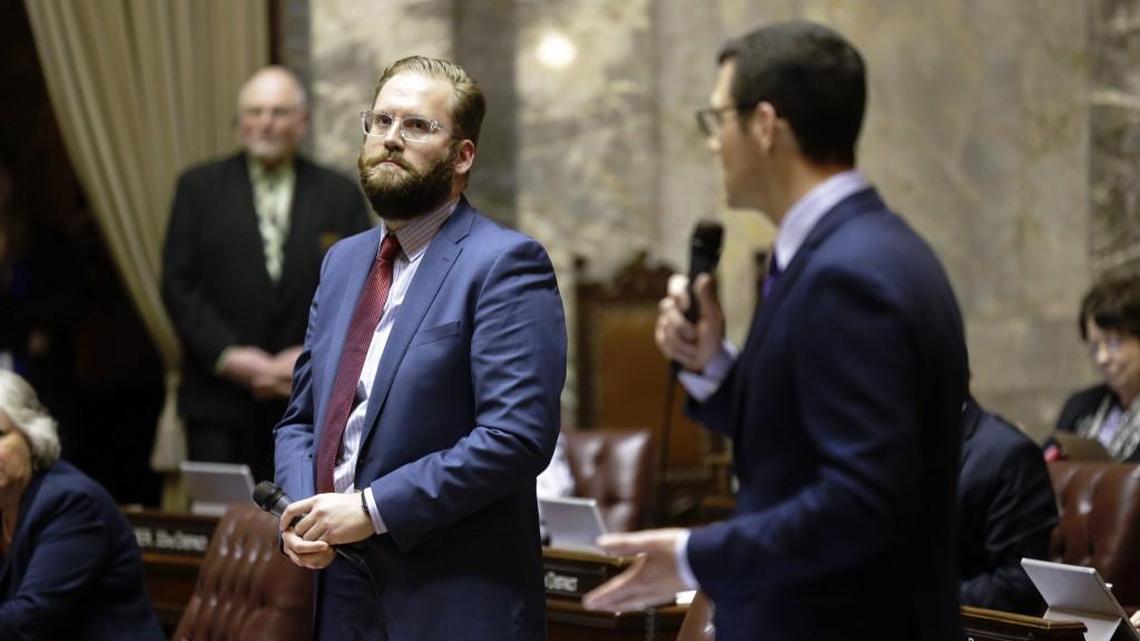 Senate Democratic floor leader Marko Liias, D-Mukilteo, left, looks on as Senate Republican floor leader Joe Fain, R-Auburn, right, makes a point on the Senate floor, Friday, Jan. 27, 2017, in Olympia, Wash. Senators were debating whether to vote on the "levy cliff" bill, which would delay a reduction in the amount of money school districts can collect though property taxes. (AP Photo/Ted S. Warren)