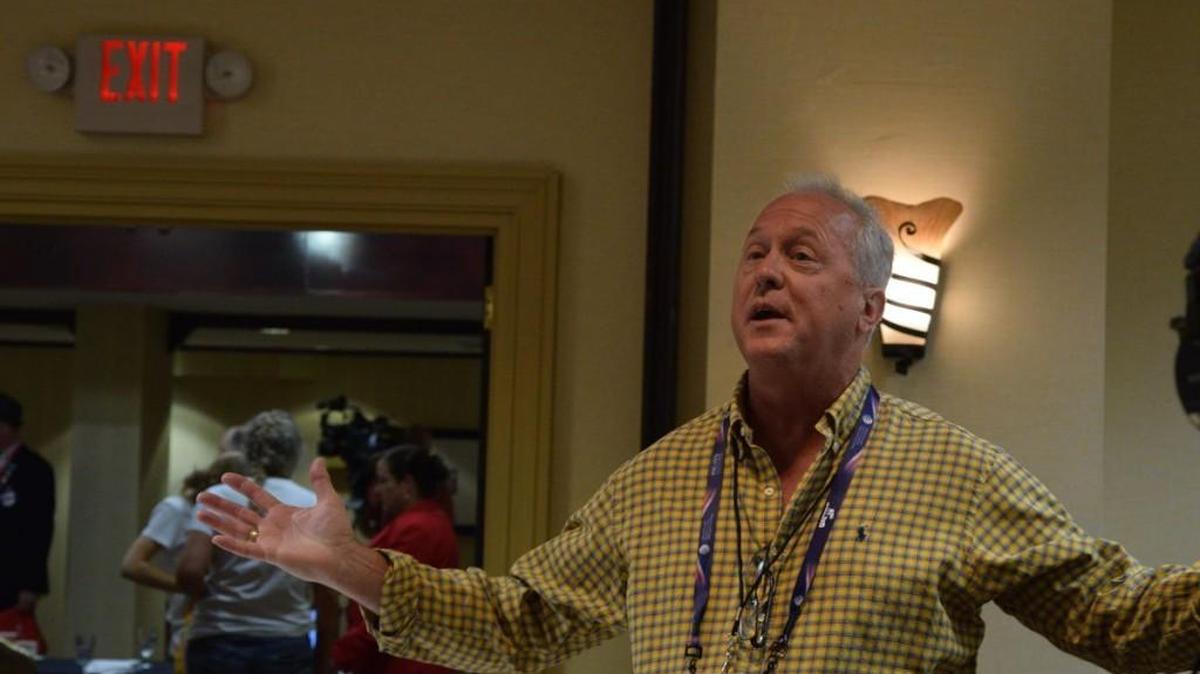 Mike McCrary, an alternate delegate from Yakima, asks a speaker at a breakfast for Washington delegates Wednesday morning about Trump being portrayed as a "pathological liar."