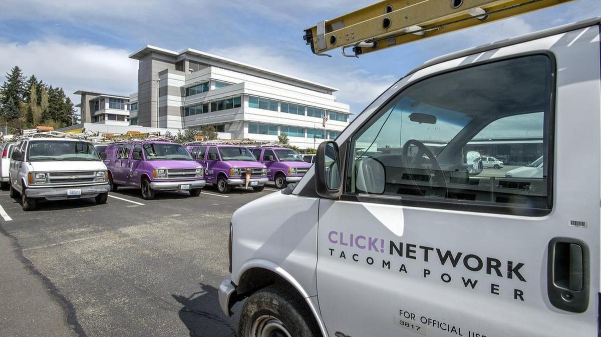 Click Network vans in march 2015 sit outside the Tacoma Public Utilities offices.