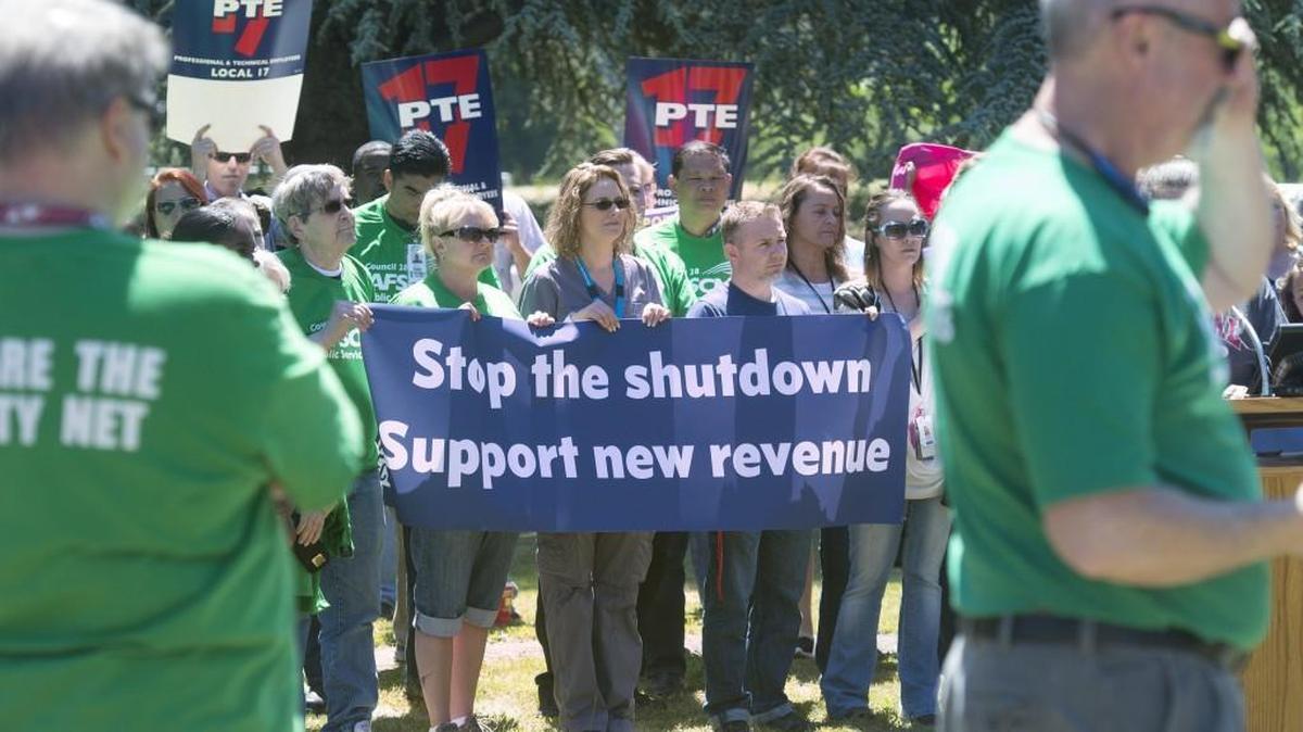 Washington state workers rally to encourage state legislators to solve the budget stalemate and avoid a partial government shutdown outside Western State Hospital in Lakewood in Thursday, June 22, 2017. The budget deal the Legislature reached this week includes money for new two-year labor contracts for state workers.