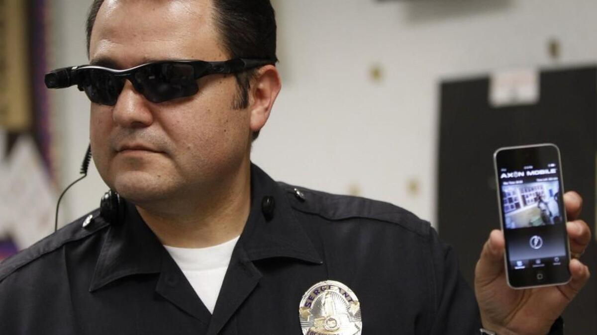 
Los Angeles Police Sgt. Daniel Gomez demonstrates a video feed from his camera into his cellphone as on-body cameras are demonstrated for the media in Los Angeles last year. In Washington state, adopting statewide standards for police body cameras continues to vex lawmakers.
