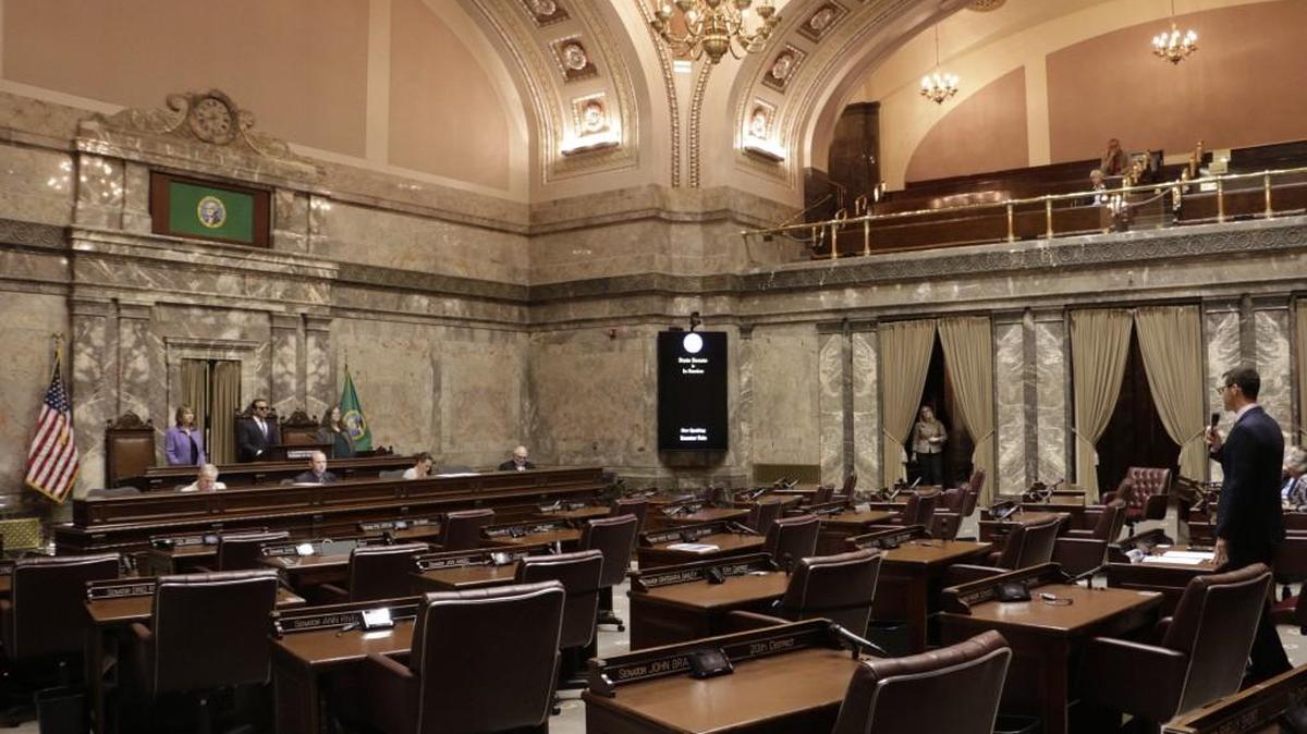 Republican Sen. Joe Fain, far right of frame, speaks in a mostly empty Senate chamber during adjournment of a 30-day special legislative session, on Tuesday, May 23, 2017, in Olympia, Wash. Gov. Jay Inslee immediately called the Legislature back for a second overtime session so that lawmakers can complete their work on the state budget.