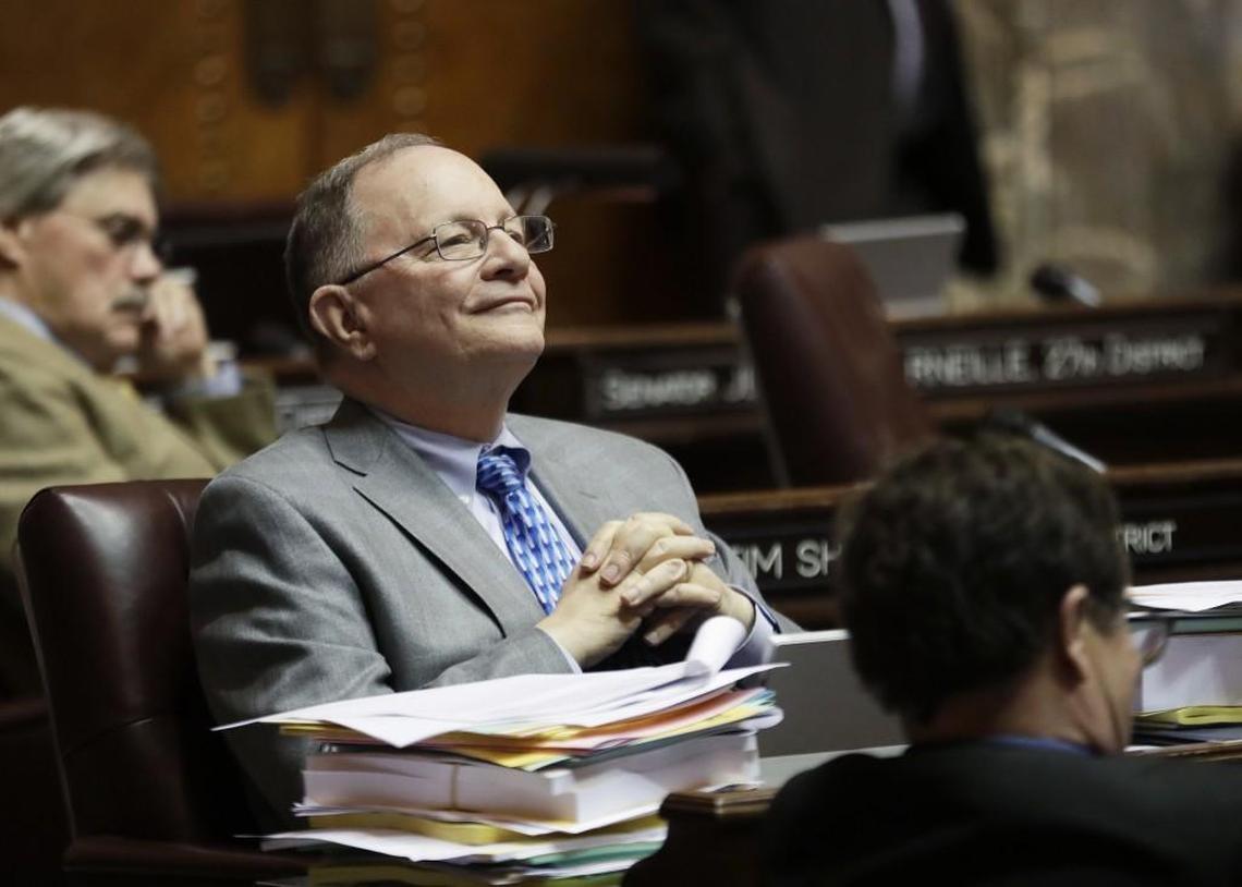 Sen. Mike Padden, R-Spokane Valley, listens to debate on the Senate floor, Thursday, March 8, 2018, at the Capitol in Olympia, Wash., on the final day of the regular session of the Legislature. Lawmakers in the Senate were discussing a compromise measure designed to make it easier to prosecute police who commit reckless or negligent shootings in Washington state. (AP Photo/Ted S. Warren)