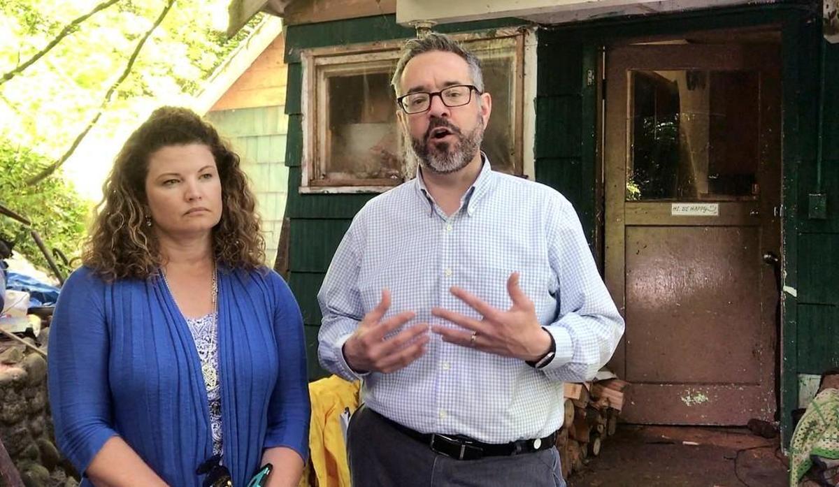 Steve Wamback, administrator of the county’s Sustainable Resources Division, and Melanie Halsan, deputy director of Pierce County’s Planning and Public Works Department, stand outside a Key Peninsula property scheduled for abatement and cleanup under a new ordinance. The former owner, Helen Skahan, died in 2015 at the age of 96. “It’s a gorgeous piece of property and it could be a lovely home,” Halsan said. “That’s what we want for this community.”