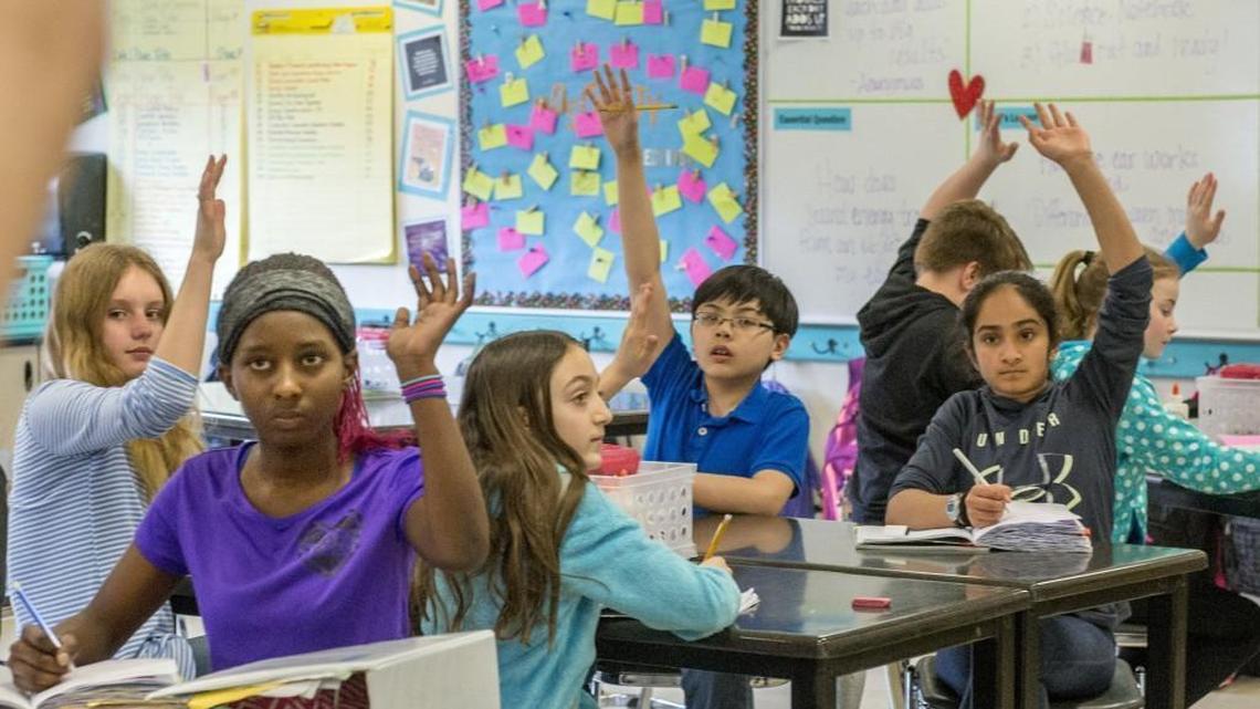 Students in a Highly Capable Science class at Chinook Middle School in Lacey on Saturday give a show of hands. State lawmakers are working to comply with a court order to fix how the state pays for schools.