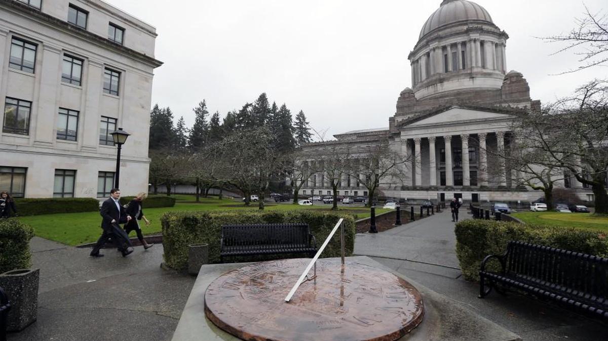 Legislative Building at the state Capitol in Olympia is shown as rain falls on the sundial in 2014.