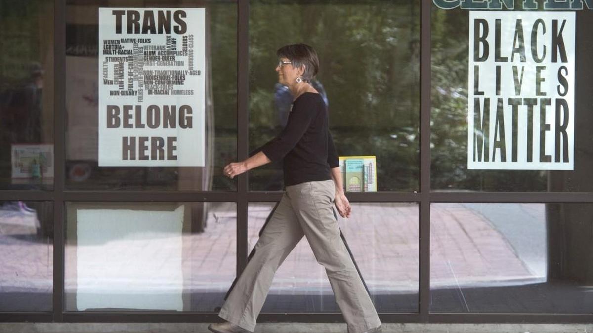 A woman walks through The Evergreen State College campus in Olympia on Thursday, June 1, 2017.