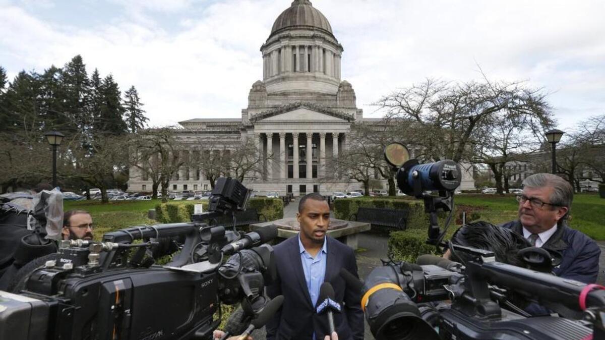 Seattle Seahawks NFL football wide receiver Doug Baldwin talks to reporters Monday, Nov. 21, 2016, after he testified at a joint legislative task force on the use of deadly force in community policing at the Capitol in Olympia, Wash. Baldwin, whose father was a police officer, has been outspoken on the issues of police training, racial profiling, and the use of force by law enforcement officers.