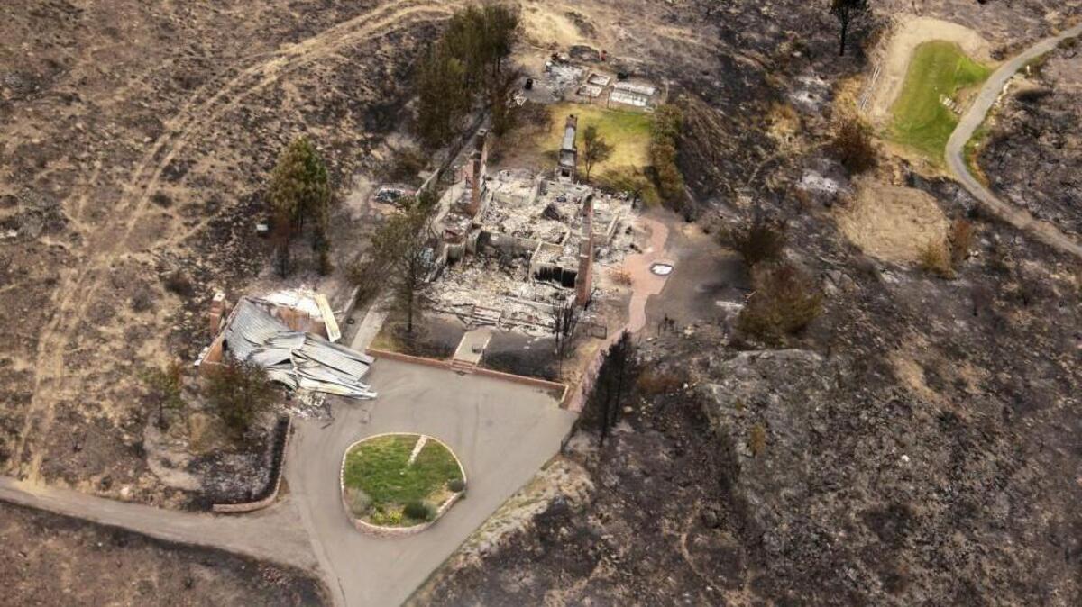 
The remains of structures that were destroyed by wildfires near Pateros are shown in July 2014. The fire was part of the Carlton Complex, the largest wildfire in Washington state history at the time.
