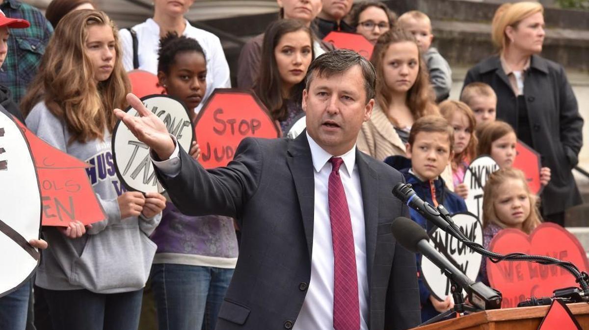 Matt Manweller, a state House Representative from the 13th District and a professor of political science at Central Washington University, chides the state Supreme Court for judicial overreach at a morning press event Wednesday on the steps of the Temple of Justice Building in Olympia, just prior to the start of the hearing regarding the McCleary school funding case.