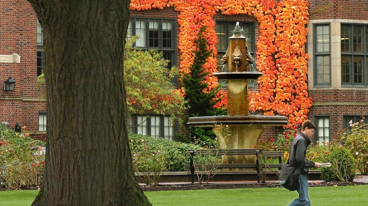 A student walks past Hilton Bowen Gardner Memorial Fountain on the University of Puget Sound campus. The Tacoma university tied Gonzaga University in Spokane as the top producer of Peace Corps volunteers among small colleges.