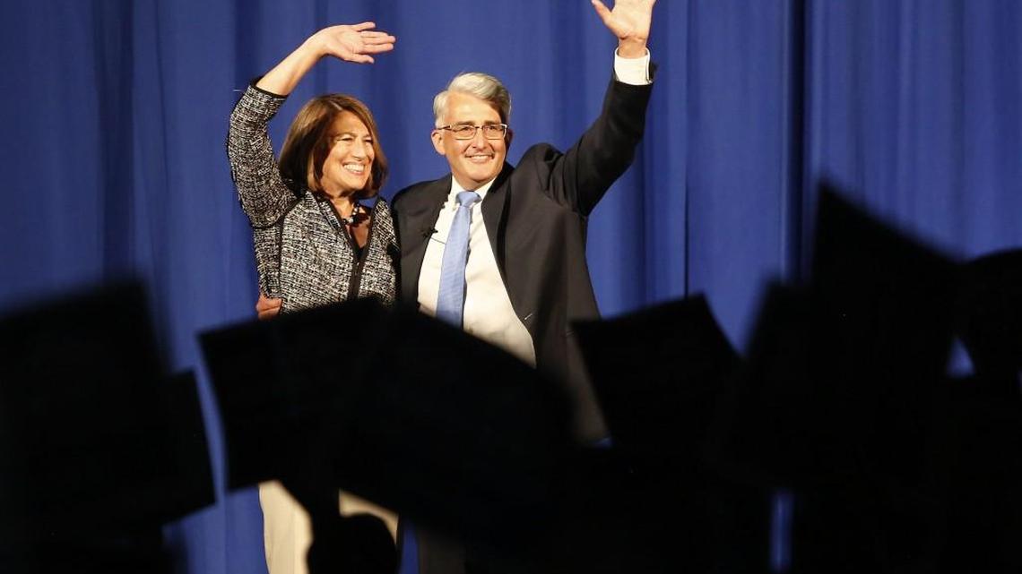 Republican candidate for governor Bill Bryant and his wife, Barbara Feasey, wave to the crowd during a rally at the Greater Tacoma Convention & Trade Center on Saturday.