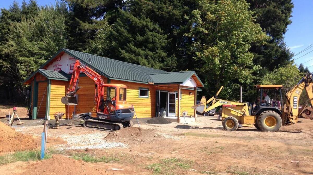 
Construction crews work Friday, Sept. 11, 2015, at a site on the Squaxin Island Tribe’s reservation that could become a retail marijuana store.
