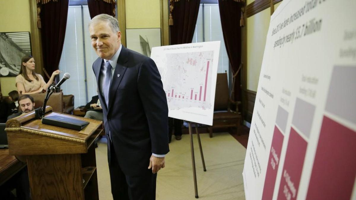 Washington Gov. Jay Inslee leaves the podium after talking about his proposed supplemental budget Thursday in Olympia.