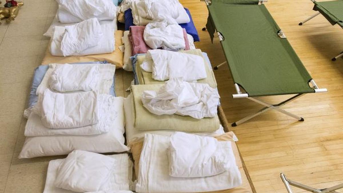 Sets of sheets and blanket to cover 50 cots are arranged at Beacon Senior Center in Tacoma. Community Youth Services runs a shelter for young adults at the center, which almost fills to capacity each night.