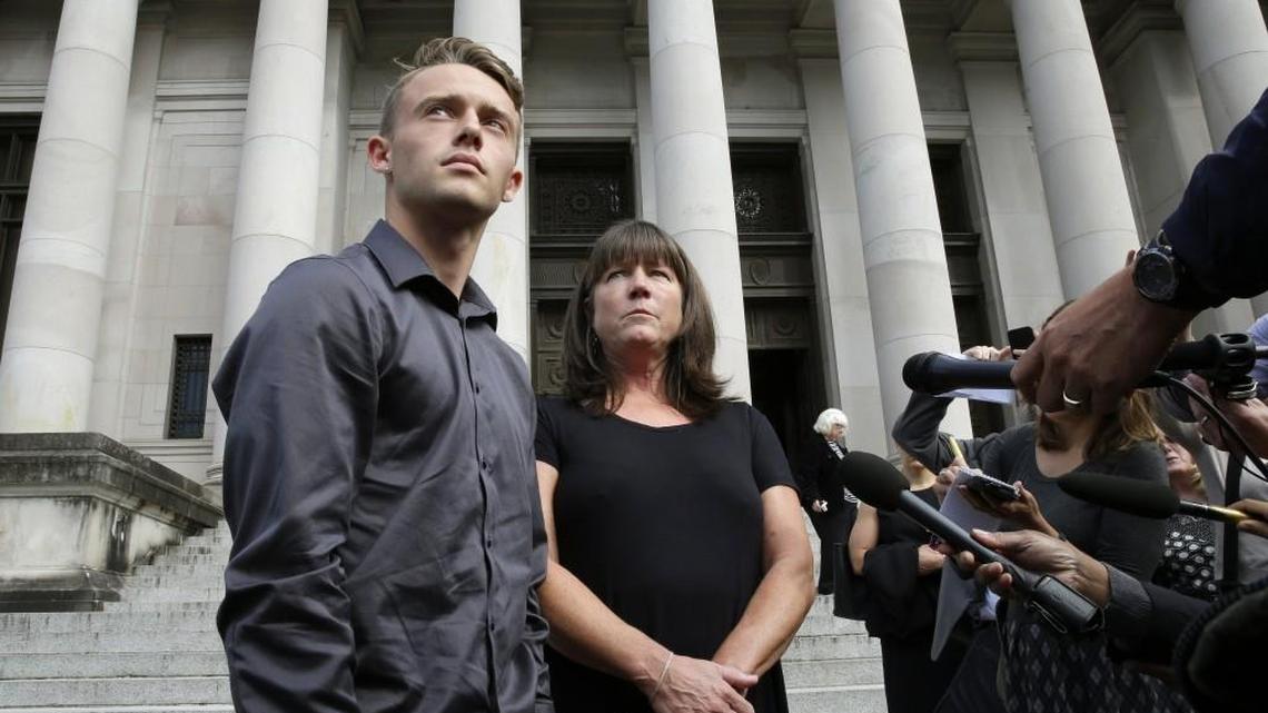 Stephanie McCleary, right, and her son, Carter McCleary, 17, talk to reporters Sept. 7 in Olympia after a Washington State Supreme Court hearing on the ongoing battle surrounding the state’s constitutional requirement to properly fund basic education. Stephanie McCleary is one of the plaintiffs in the case. A task force of lawmakers received data Tuesday that they say will help them come up with a plan to solve remaining shortfalls outlined in the lawsuit.