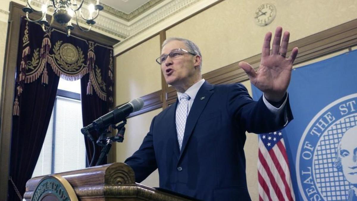Gov. Jay Inslee talks to the media about bills related to union membership and employee birth dates on Thursday in Olympia. An ongoing battle between a powerful labor union and a conservative think tank has been playing out in the Legislature as lawmakers consider bills at the center of a years-long fight.