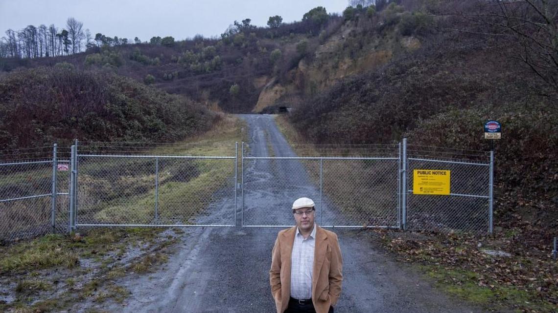 Mel Berglund of Northeast Tacoma opposes reopening this gravel mine on Marine View Drive, seen Sunday.