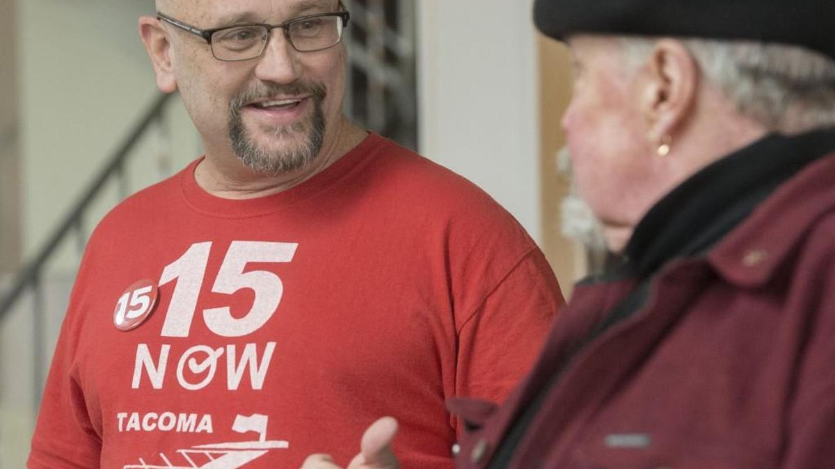 15 Now campaign volunteers Vince Kueter, left, and Loren Bliss talk before early results came in Tacoma on Tuesday, Nov. 3, 2015. Kueter said he felt confident voters would pass one of the two initiatives supporting a minimum wage hike in Tacoma.