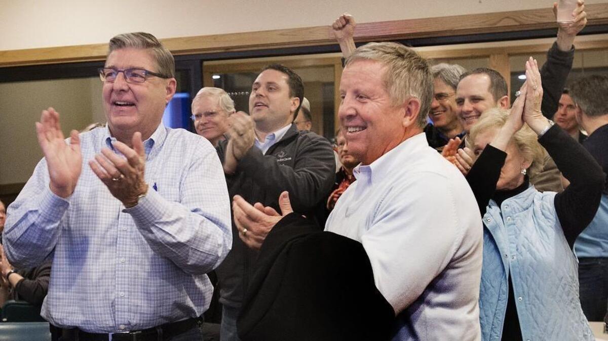 Supporters of a campaign against the proposed Pierce County general services building cheer early results that showed the referendum winning by a wide margin Tuesday. At left in foreground is Randy Boss, a Charter Review Commission candidate, and Jim Merritt.
