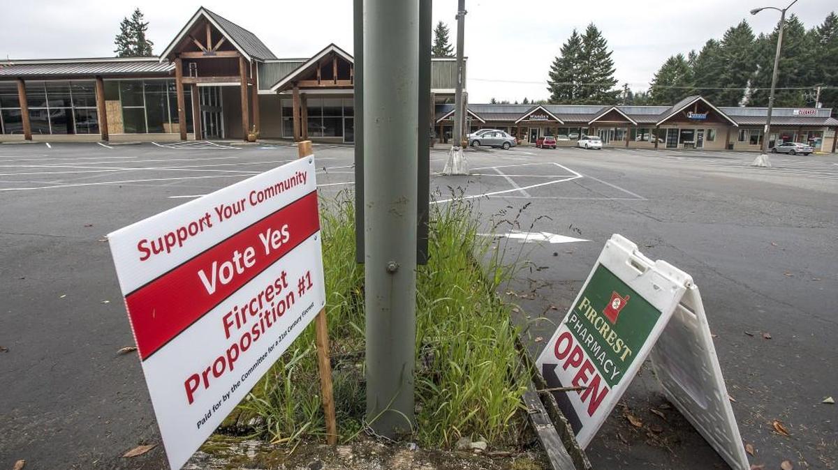 A Proposition 1 sign in front of Fircrest Town Center shopping complex is shown from October.