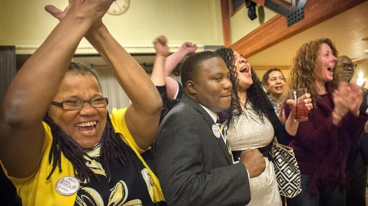 Tacoma City Council candidate Keith Blocker, center, celebrates with his wife, Christina, while his mother, April Blocker, left, is jubilant of polling results coming in against Tom McCarthy on Tuesday, Nov. 03, 2015.