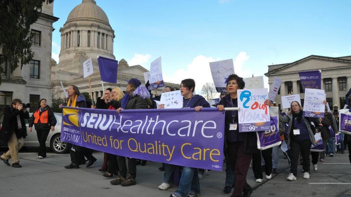 In this file photo, health care workers from the Service Employees International Union 775 march on the Capitol on Feb. 7, 2013 to lobby lawmakers for contract funding. This year, the union is the main backer of Initiative 1501.