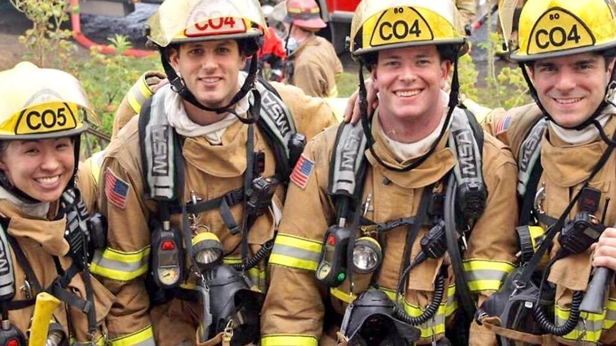 Probationary Tacoma firefighter Ramsey Mueller, second from right, poses with fellow firefighters during training in 2016. He died later that summer of a drug overdose.