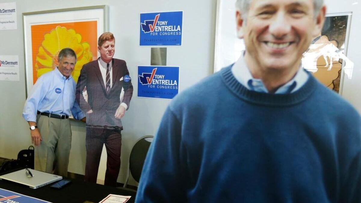 Congressional candidate Tony Ventrella, left, poses for a photo with a life-size photo of John F. Kennedy as his own life-size image is displayed at right, in June at the Washington state Democratic Convention in Tacoma. Ventrella, a Democrat, is running for Congress in the 8th Congressional District against incumbent Republican U.S. Rep. Dave Reichert.