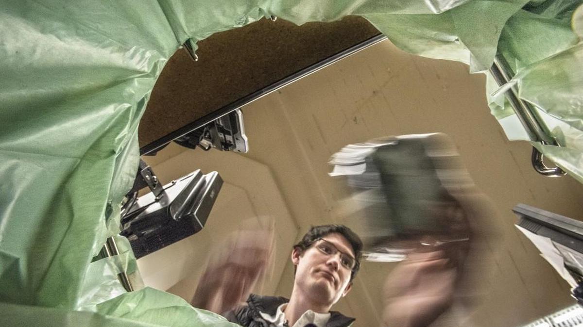 Mitchell Sissons of Stadium Thriftway in Tacoma places a customer’s groceries into a recycled plastic bag in December 2015. The Tacoma City Council may vote on banning disposable plastic bags as soon as April 26.