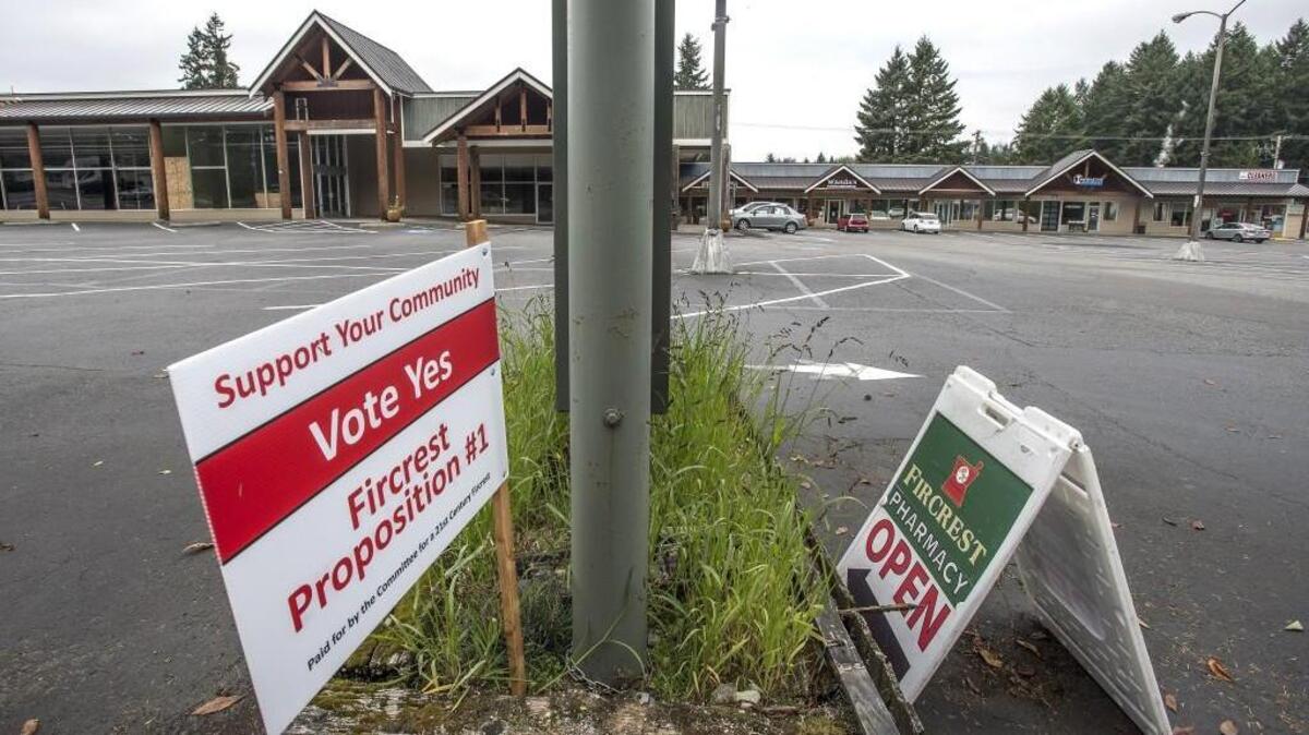 A Proposition 1 sign is on display in front of Fircrest Town Center in October. The City Council on Tuesday night unanimously approved the sale of alcohol by the glass in its neighborhood commercial zone, removing the final hurdle for businesses there that want to serve drinks to customers.