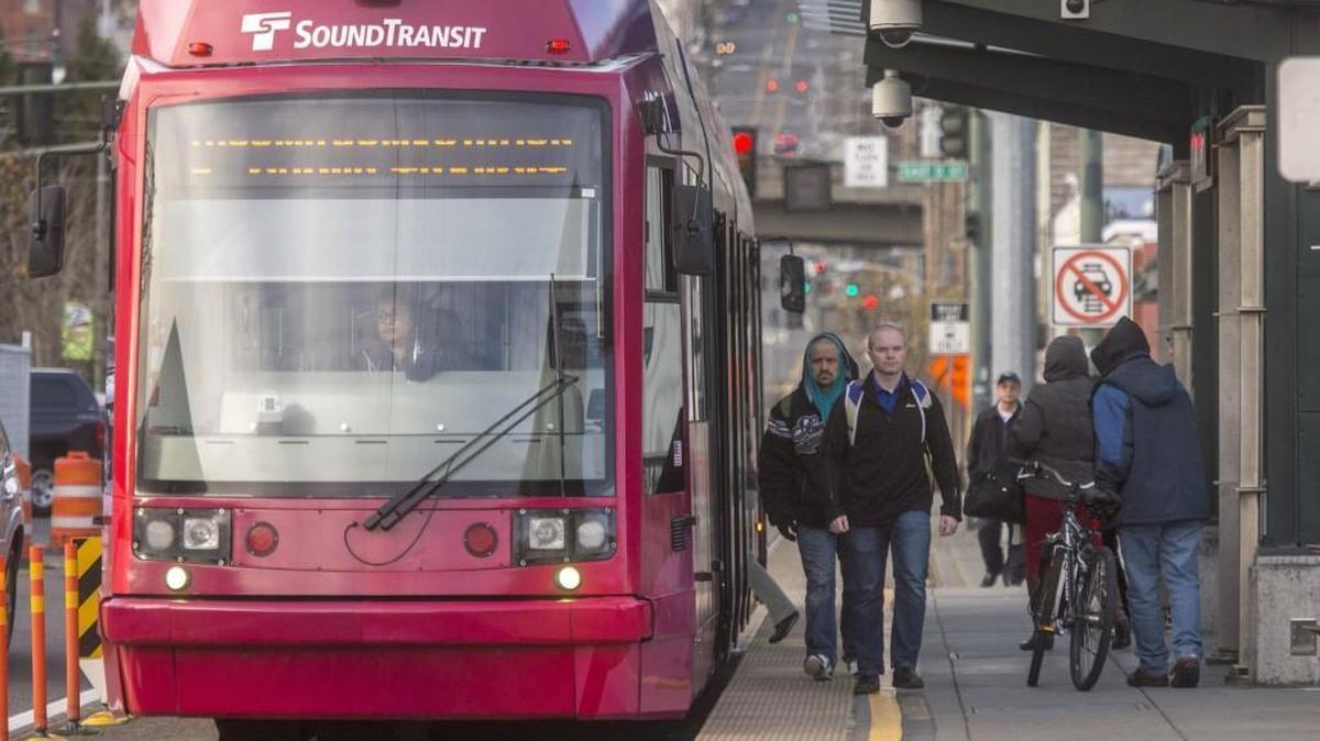 Riders come and go at the Tacoma Link light-rail platform at the Tacoma Dome Station, December 14, 2016.