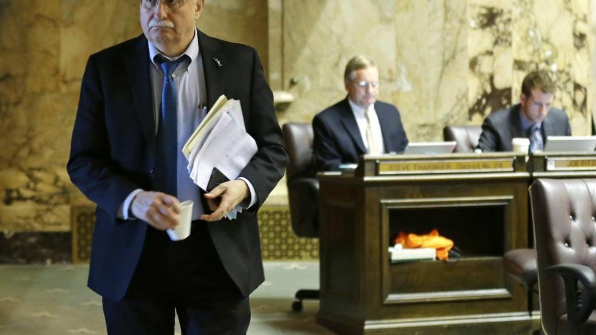 Speaker Frank Chopp, D-Seattle, walks on the House floor Feb. 22 during debate over education funding at the Capitol in Olympia.