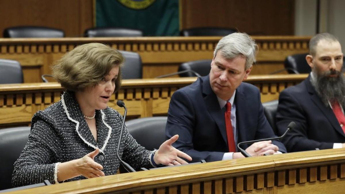 Sen. Christine Rolfes, D-Bainbridge Island, left, chairwoman of the Senate Ways and Means Committee, speaks as House Majority Leader Pat Sullivan, D-Covington, right, looks on during the education funding panel of the Associated Press' annual Legislative Preview, Thursday, Jan. 4, 2018, at the Capitol in Olympia, Wash. (AP Photo/Ted S. Warren)
