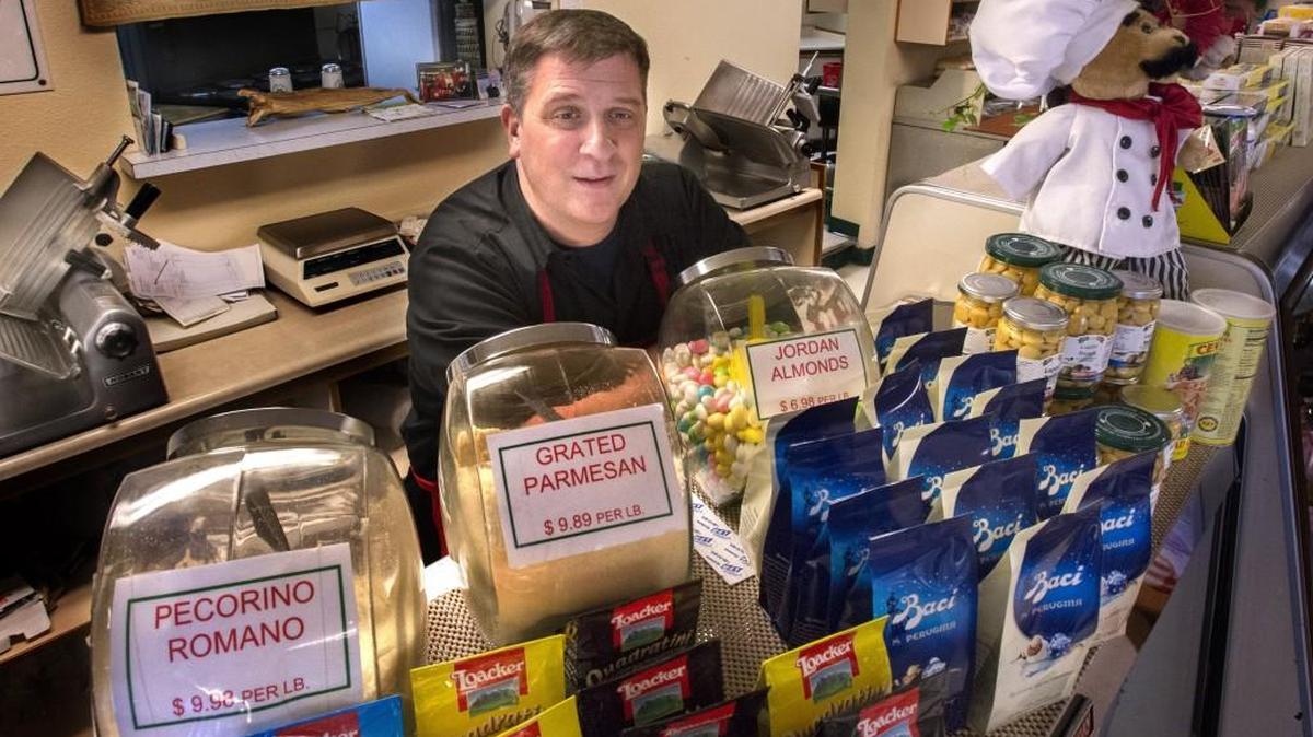David Viafore gets ready to help a customer at Viafore’s Italian Delicatessen in Fircrest on Dec. 9. Viafore ended his 24-year run as an elected official in Fircrest last week.