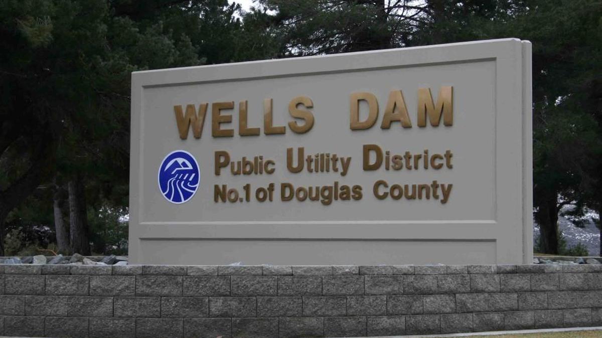 A sign for the Wells Dam in 2007, near Pateros, Washington. The Wells Hatchery is adjacent to the dam and is owned by the Douglas County Public Utility District.