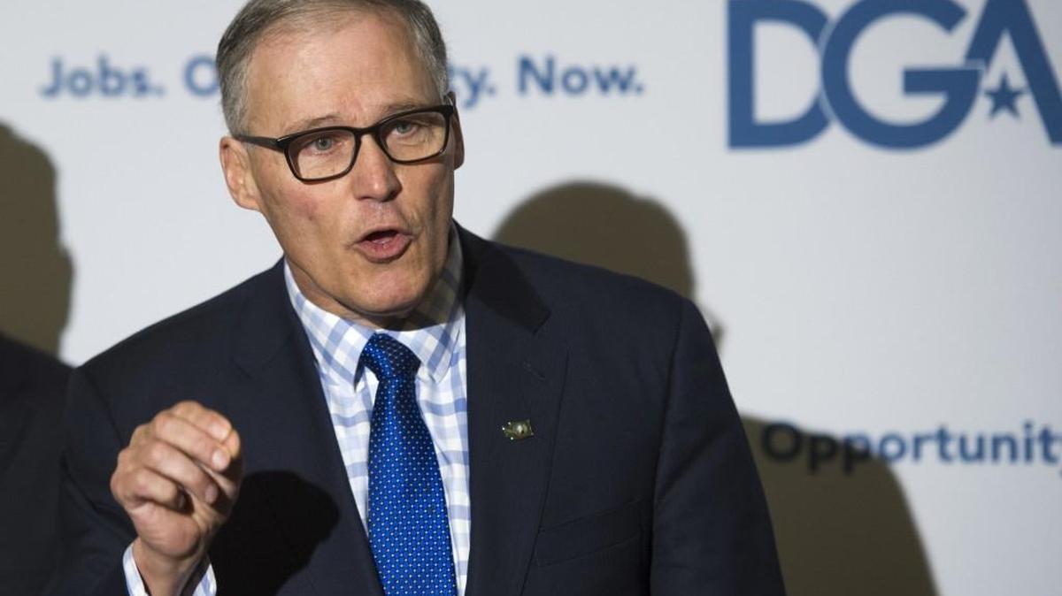 Washington state Gov. Jay Inslee speaks at a news conference following a meeting in Washington, D.C. on Saturday, Feb. 25, 2017. Inslee and Washington state Attorney General Bob Ferguson, both Democrats, have threatened legal action if President Donald Trump ends protections for immigrants brought to the country illegally as children.