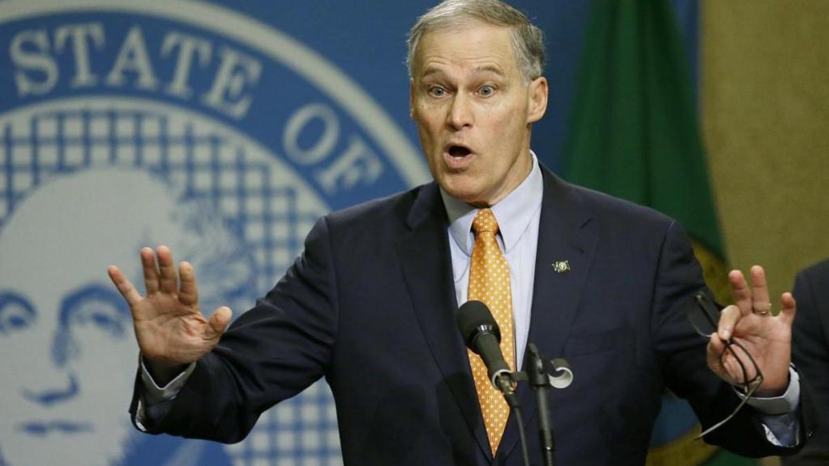 Washington Gov. Jay Inslee talks to reporters Feb. 23 at the Capitol in Olympia. Republicans allege that Inslee’s re-election campaign benefited from millions of dollars from state worker unions while those unions were negotiating new contracts with his office.