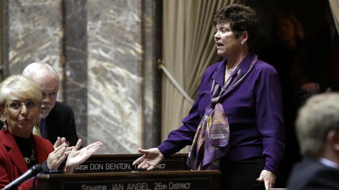 Sen. Pam Roach, R-Auburn, stands and is applauded after being elected as President Pro Tempore in the Senate at the start of the newest legislative session, Monday, Jan. 12, 2015, in Olympia, Wash. (AP Photo/Elaine Thompson)